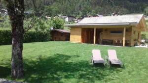 Vrt pred nastanitvijo Kolbitsch am Weissensee ein Seeblick der verzaubert inklusive Premiumcard
