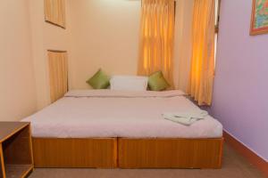 Letto o letti in una camera di Swastik Guest House