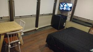 Et tv og/eller underholdning på Apartment Esmeralda 740 Microcentro Downtown Area