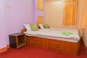 Letto o letti in una camera di Swastik Guest House