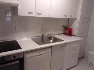 Kuchyň nebo kuchyňský kout v ubytování APARTAMENTO BRAZATO