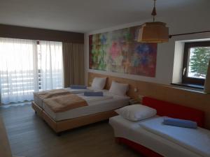 Postel nebo postele na pokoji v ubytování Family Hotel Schloss Rosenegg