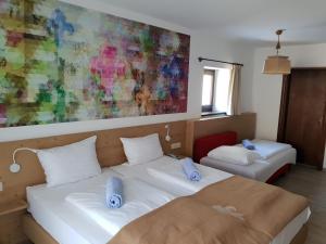 Postel nebo postele na pokoji v ubytování Family Hotel Schloss Rosenegg
