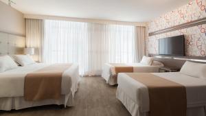 Katil atau katil-katil dalam bilik di Vivaldi Hotel Loft Punta Carretas