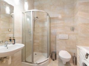 a bathroom with a shower and a sink and a toilet at Rent like home - Marea in Międzyzdroje