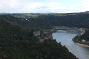 an aerial view of a castle in the middle of a river at Loreley bed and breakfast in Bornich