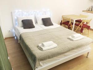 Postel nebo postele na pokoji v ubytování Sunny Days Gudauri