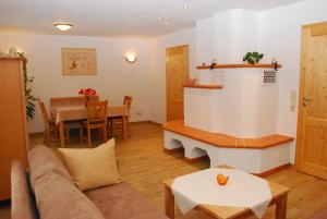 a living room with a couch and a table at Ferienhaus Becker in Schönau