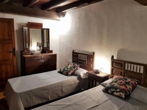 Llit o llits en una habitació de Casa de la Font de Dalt