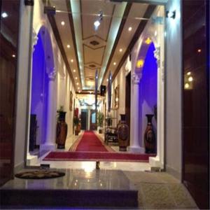 a hallway of a building with purple lights at Al Fanar Palace 1 in Riyadh