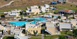 an aerial view of a resort with a swimming pool at Natura Park Village Hotel & Spa in Psalidi