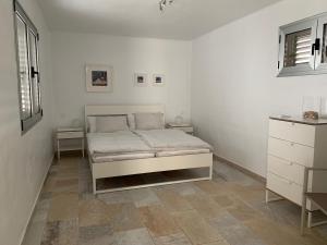 a bedroom with a bed in a white room at Villa Malagueñas in Puerto del Carmen +41 photos