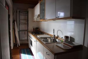 Kuchyň nebo kuchyňský kout v ubytování Maso Drigo