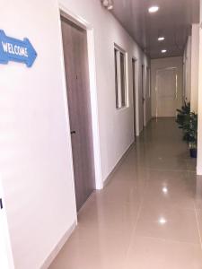 a hallway of an office building with a door at Tropical Breeze Aeropuerto in San Andrés