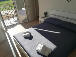 Llit o llits en una habitació de B&b A Due Passi Dal Sole