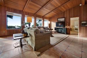 a living room with a couch and a table at Sunset Point in Fort Bragg