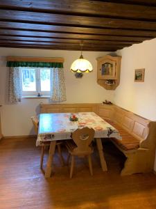 a dining room with a table and a chair at Hochkirg Lehen in Donnersbach