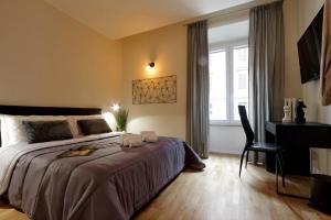 A bed or beds in a room at Termini Terrace