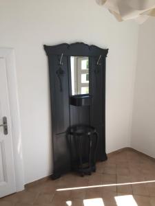 a black door in a room with a stool at Apart-ment 84 in Herdecke