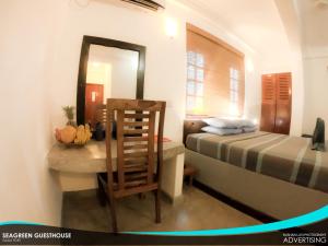 Postel nebo postele na pokoji v ubytování Seagreen Guesthouse - Galle Fort
