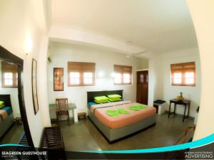 Postel nebo postele na pokoji v ubytování Seagreen Guesthouse - Galle Fort
