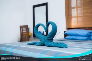Postel nebo postele na pokoji v ubytování Seagreen Guesthouse - Galle Fort
