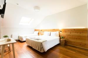 Кровать или кровати в номере Ericeira Soul Guesthouse