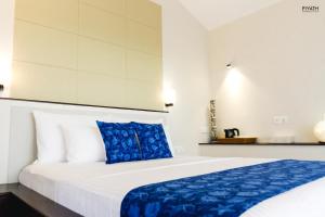 Tempat tidur dalam kamar di Ayana Beach