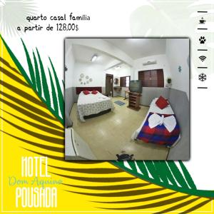 Cartel de una habitación de hotel con cama y TV en Pousada Dom Aquino, en Campo Grande