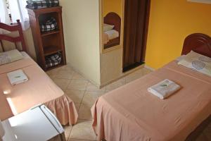 Postel nebo postele na pokoji v ubytování Pousada da Rose Paraty