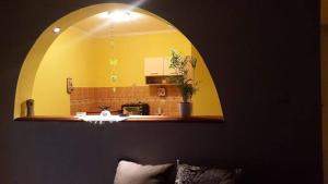 a mirror on the wall of a kitchen in a room at Apartman Fenix in Belgrade +50 photos