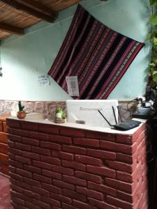 a brick counter in a room with a window at Hostería el Sol Naciente in Tilcara +52 photos