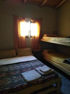 Ένα ή περισσότερα κρεβάτια σε δωμάτιο στο Tree House Hostel