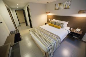 Giường trong phòng chung tại Hotel Ojos Del Rio