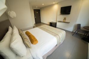 Giường trong phòng chung tại Hotel Ojos Del Rio