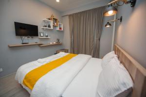 Postel nebo postele na pokoji v ubytování Easy Hotel T'bilisi