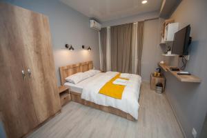 Postel nebo postele na pokoji v ubytování Easy Hotel T'bilisi