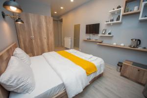Postel nebo postele na pokoji v ubytování Easy Hotel T'bilisi