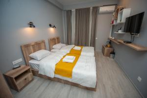Postel nebo postele na pokoji v ubytování Easy Hotel T'bilisi