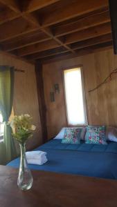 Una cama o camas en una habitación de Rustico Pucon