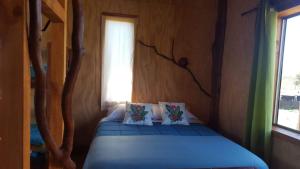 Una cama o camas en una habitación de Rustico Pucon