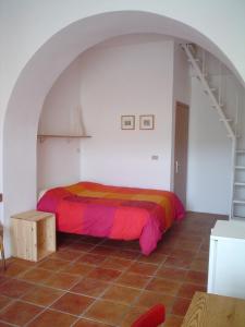 Un pat sau paturi într-o cameră la B&B Calabria