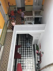 an overhead view of a staircase with people in a building at Student’s Hostel in Montevideo