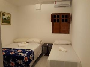 Postel nebo postele na pokoji v ubytování Pousada Praia Bela Maceió