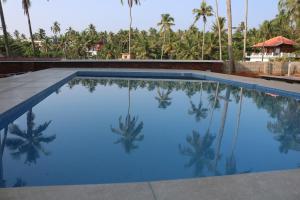 The swimming pool at or close to Magnolia Guesthouse Varkala