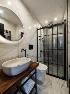 a bathroom with a sink and a bathtub at GalataCo Hotel in Istanbul
