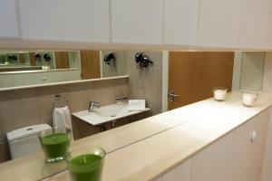 a bathroom with a sink and a mirror at MH Apartments Sant Pau in Barcelona