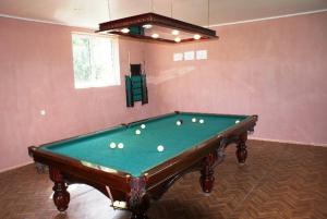 a room with a pool table with balls on it at Odzun Hotel in Alaverdi