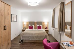 Postel nebo postele na pokoji v ubytování Hotel & Restaurant Lamm