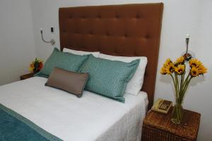 Postel nebo postele na pokoji v ubytování Los Milagros Hotel